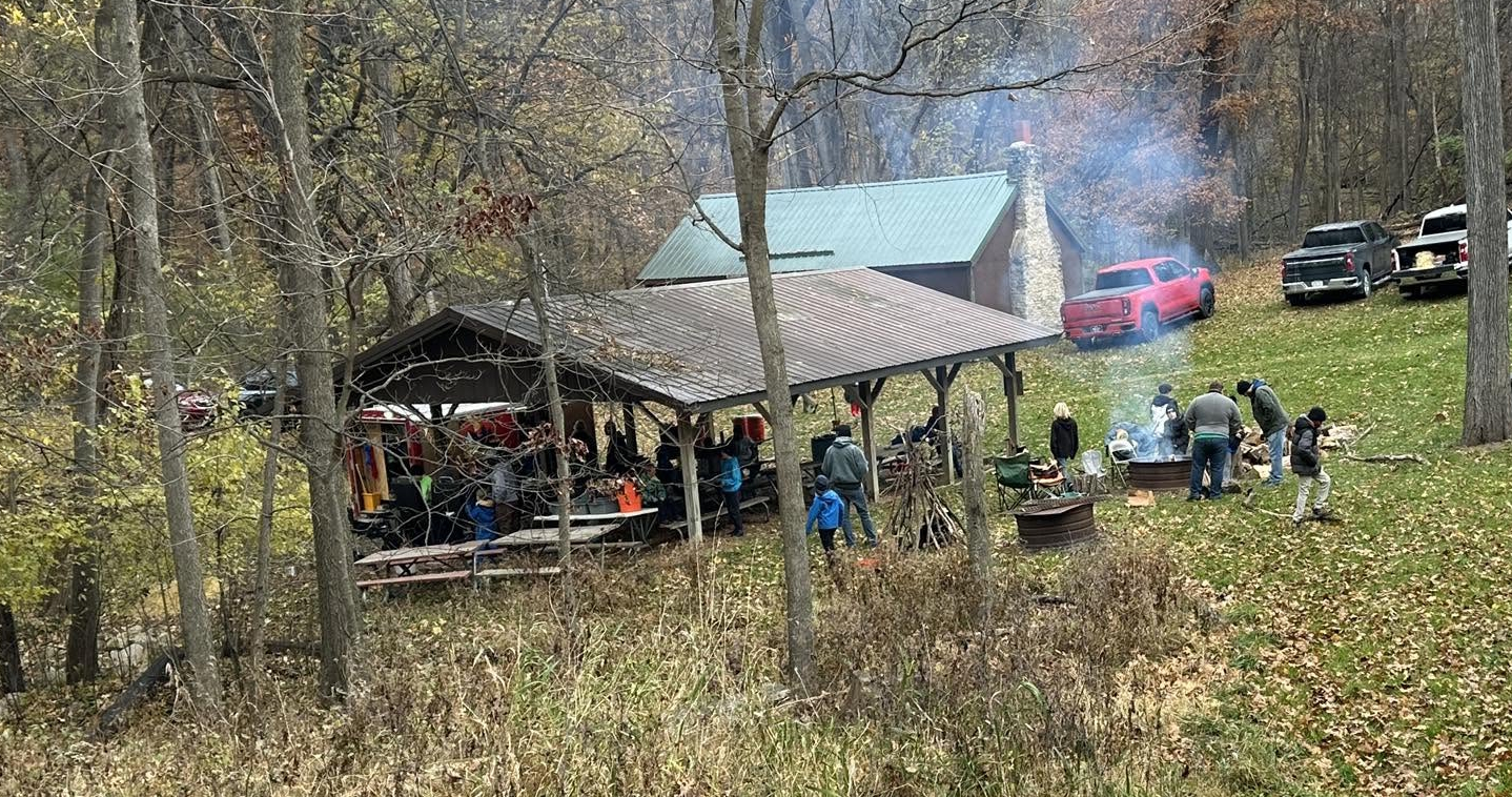 Family tents set up in a wooded campsite