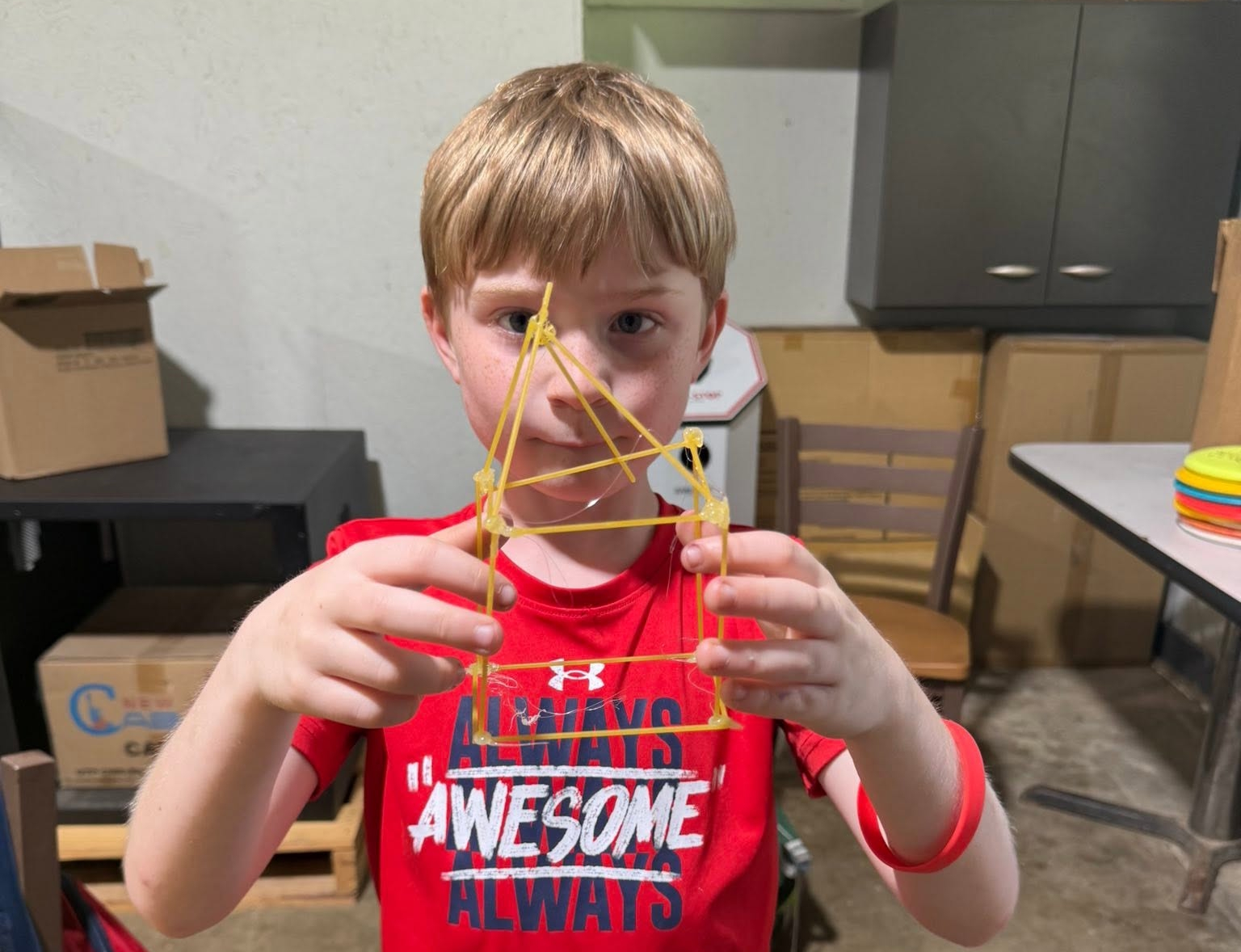 Kids doing a hands-on science activity with a volunteer